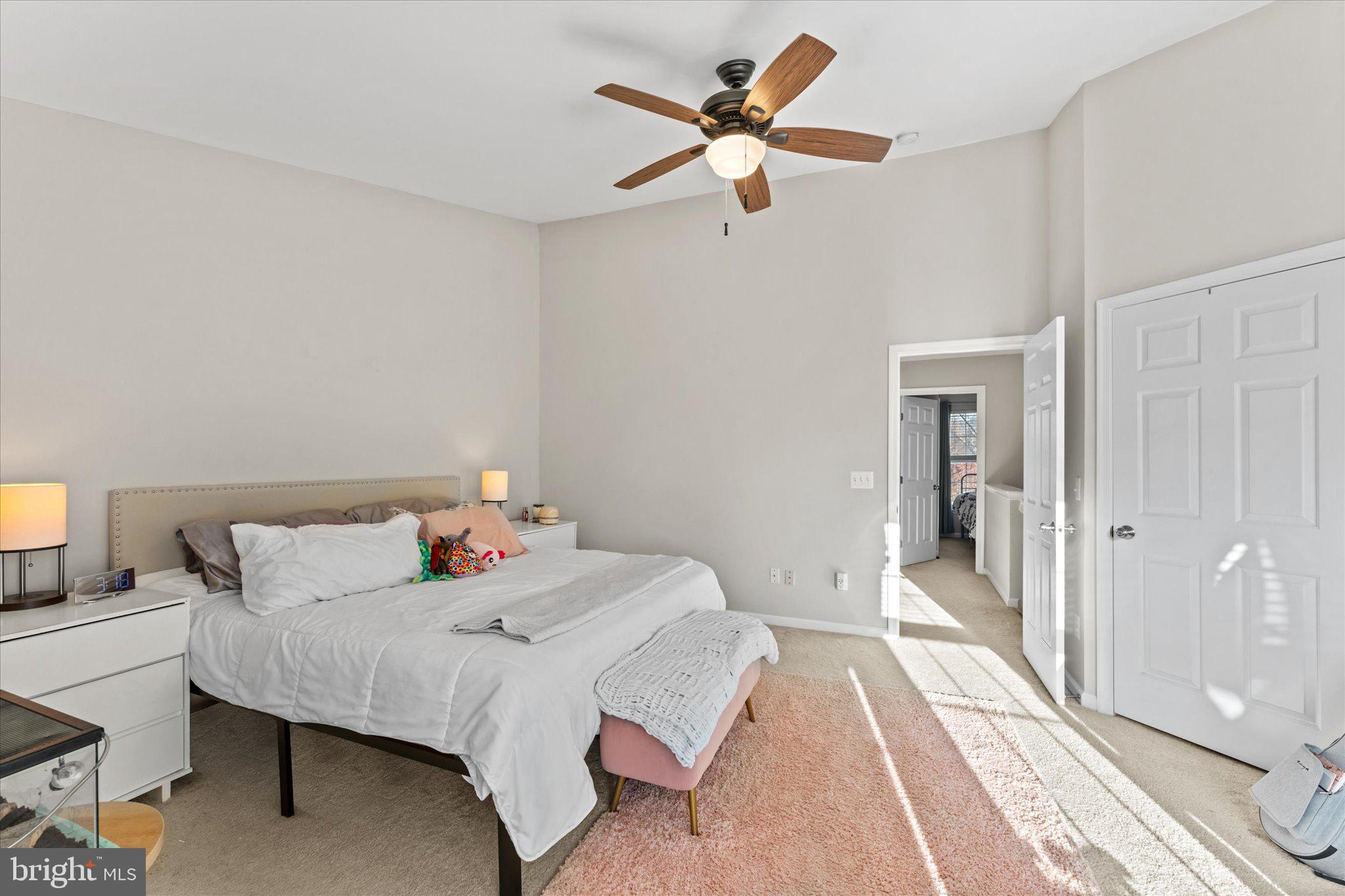163 Shirley Square Southeast Leesburg, VA 20175 - Photo 25 of 45 a bedroom with a bed and a chandelier