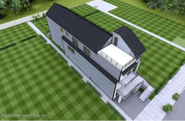 a view of a backyard with sitting area