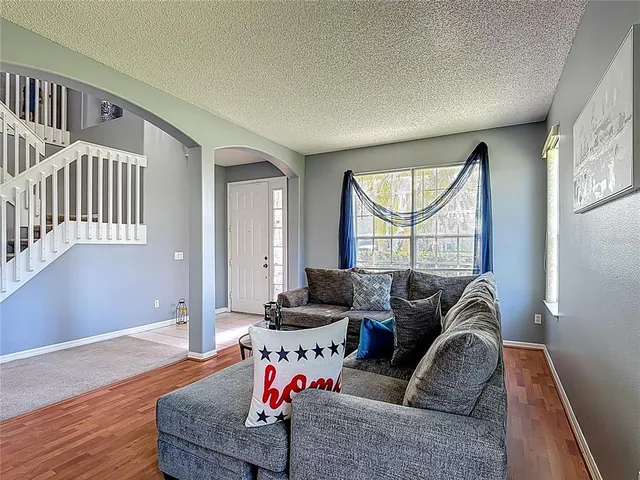 a living room with furniture and a rug