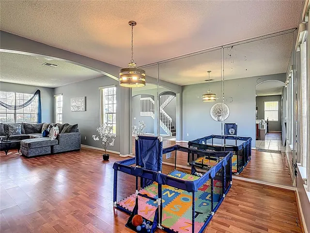 a view of a dining room with furniture and window