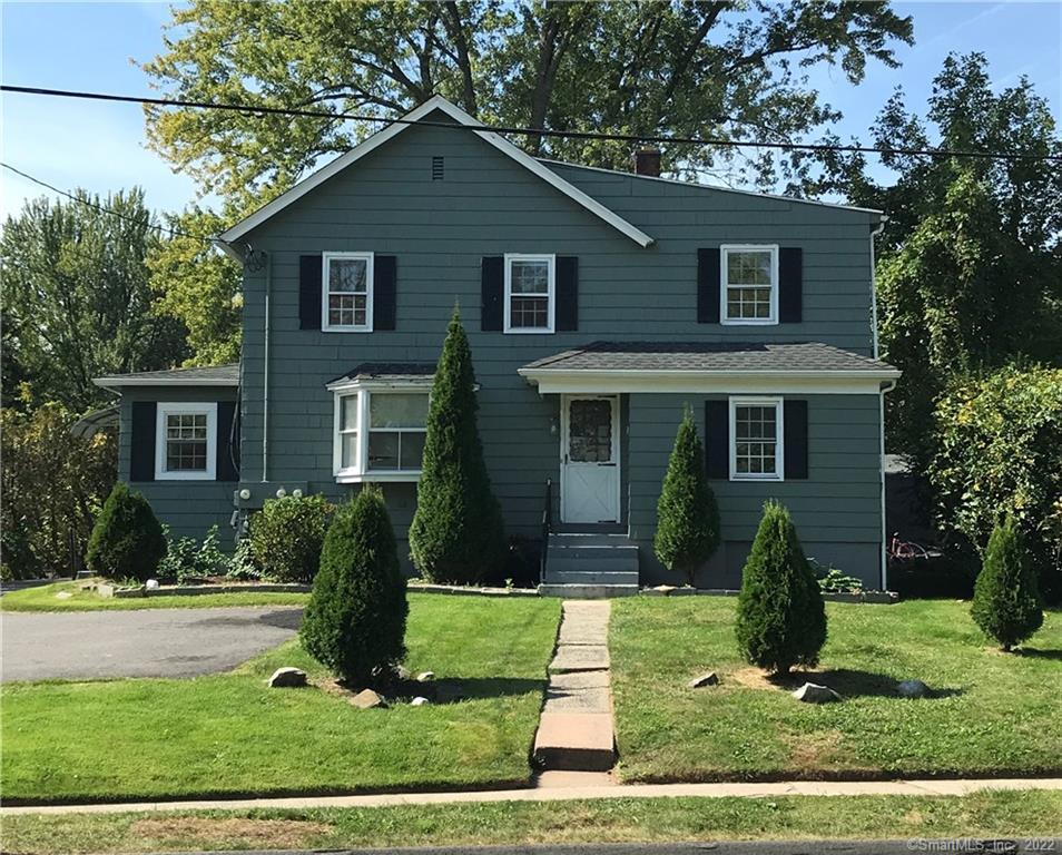 55 Spring Street Wethersfield, CT 06109 - Photo 1 of 1 a view of a yard in front view of a house