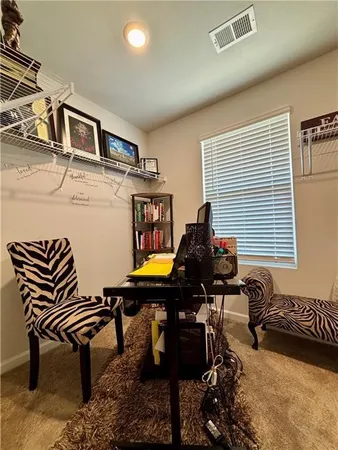 a bedroom with furniture and a window