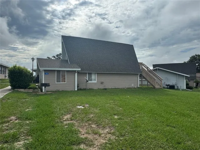 a house view with a garden space