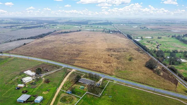 a view of swimming pool with a yard