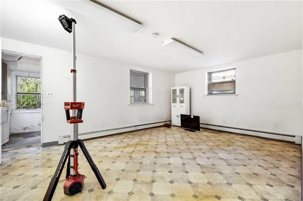 a room with lots of furniture and a window