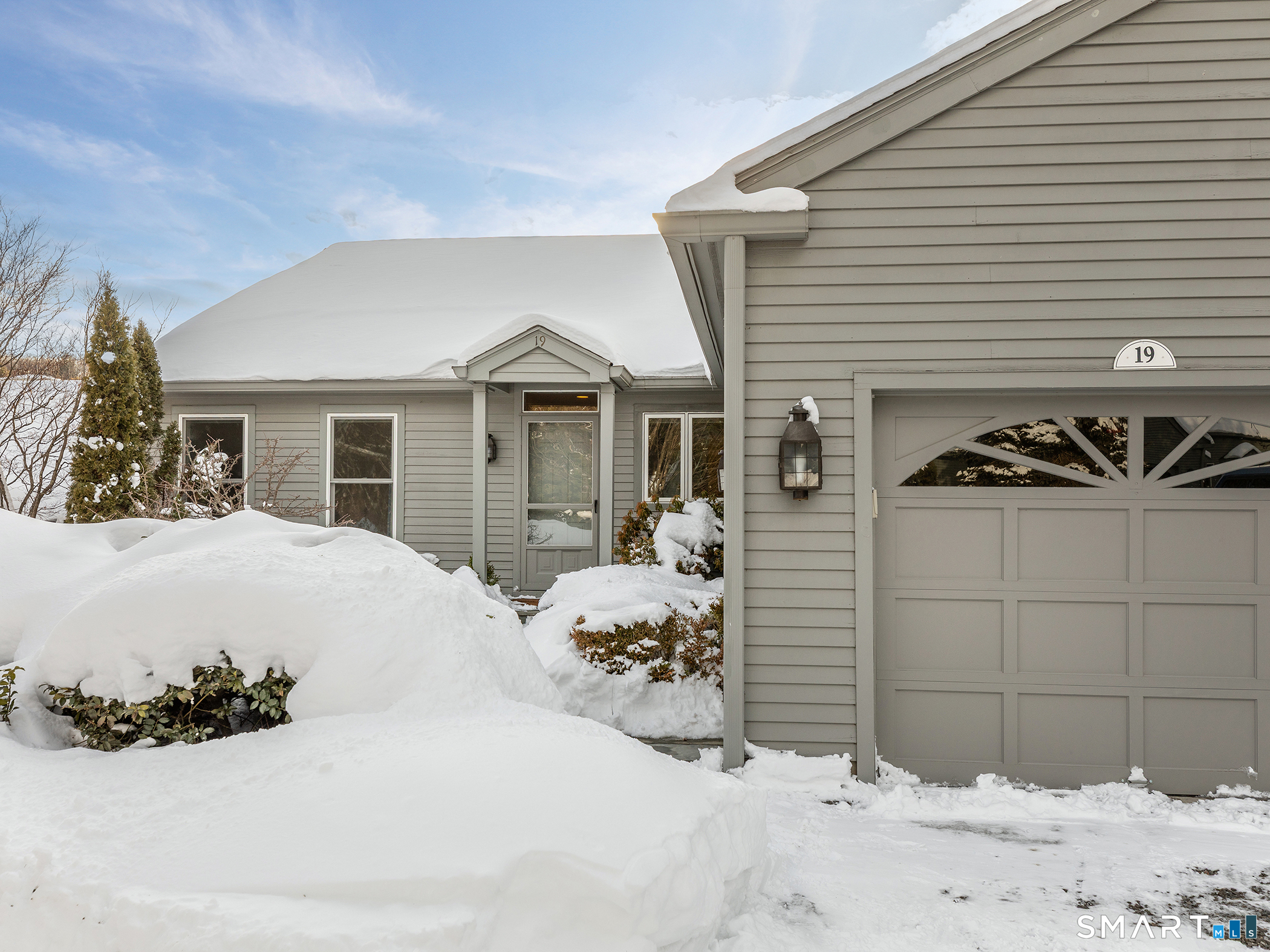 a view of a house with a snow on the road