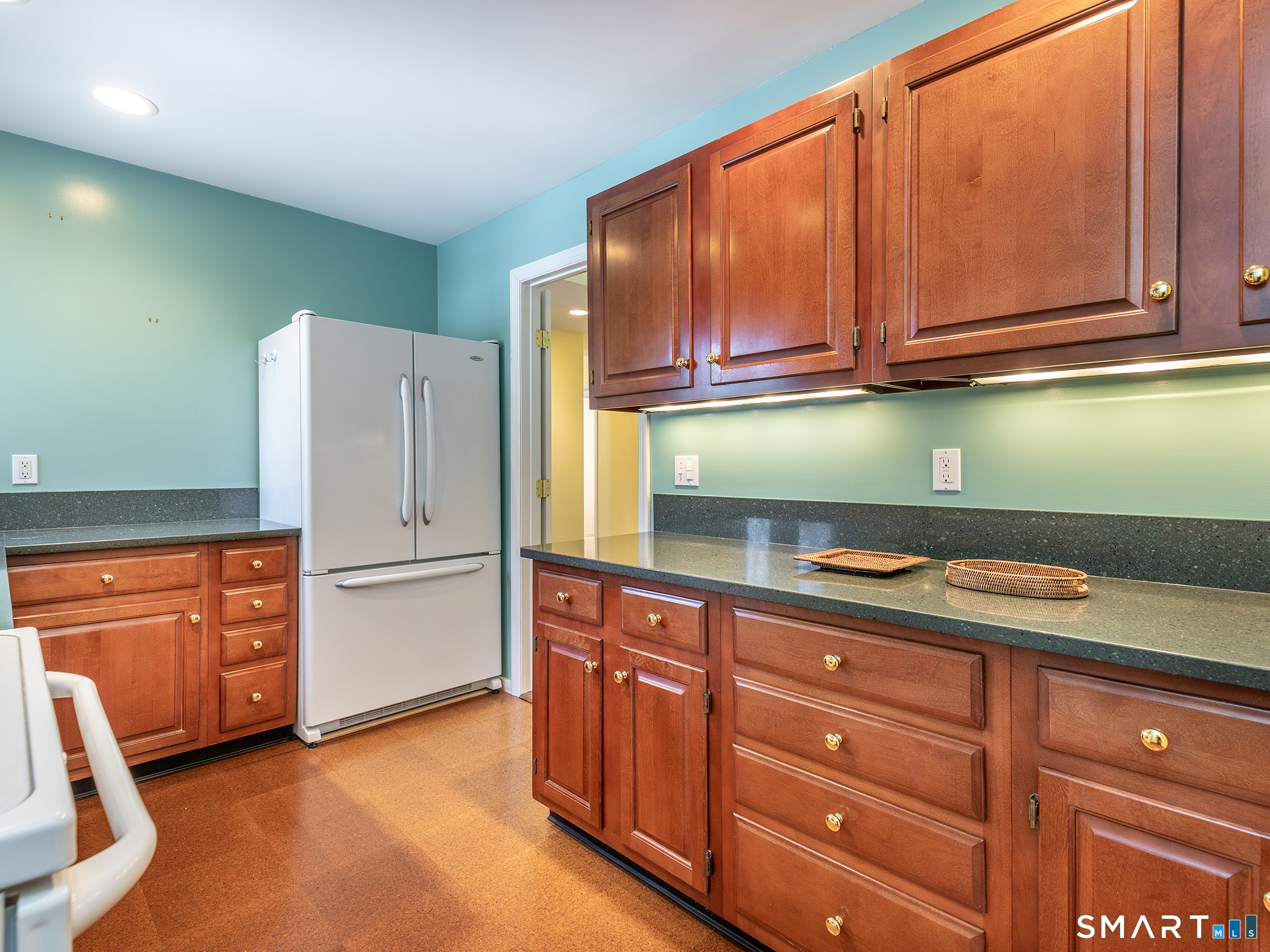 19 Juniper Meadow Road, Unit 19 Washington, CT 06794 - Photo 11 of 31 a kitchen with stainless steel appliances granite countertop a refrigerator and cabinets