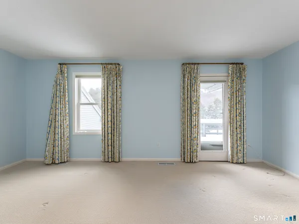 a view of empty room with windows