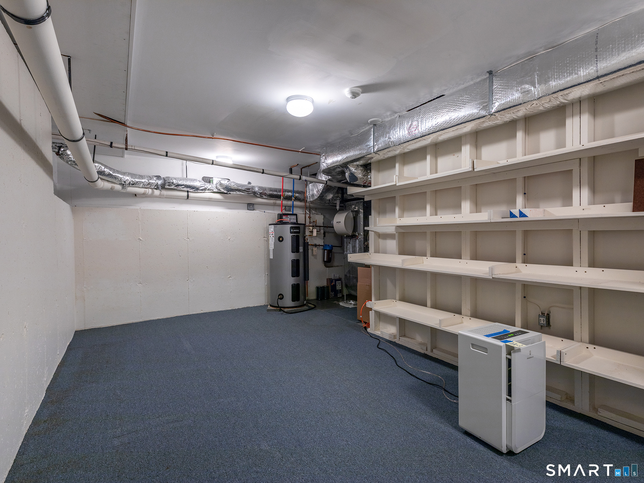 19 Juniper Meadow Road, Unit 19 Washington, CT 06794 - Photo 29 of 31 a view of an empty room with shelves