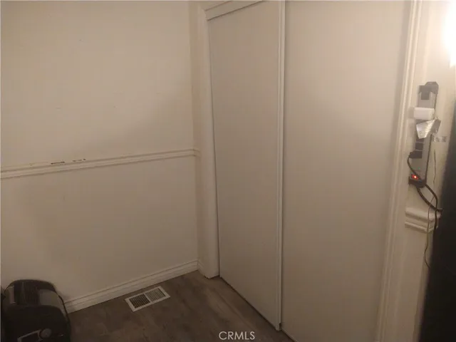 a bedroom with a bed and a mirror