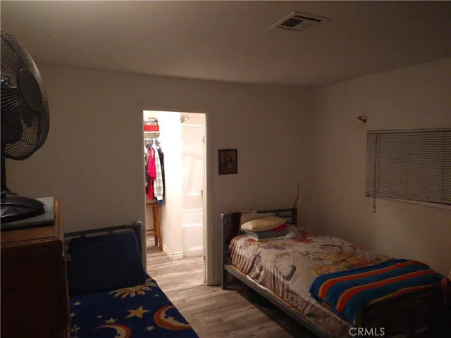 a view of storage and utility room with racks on the wall