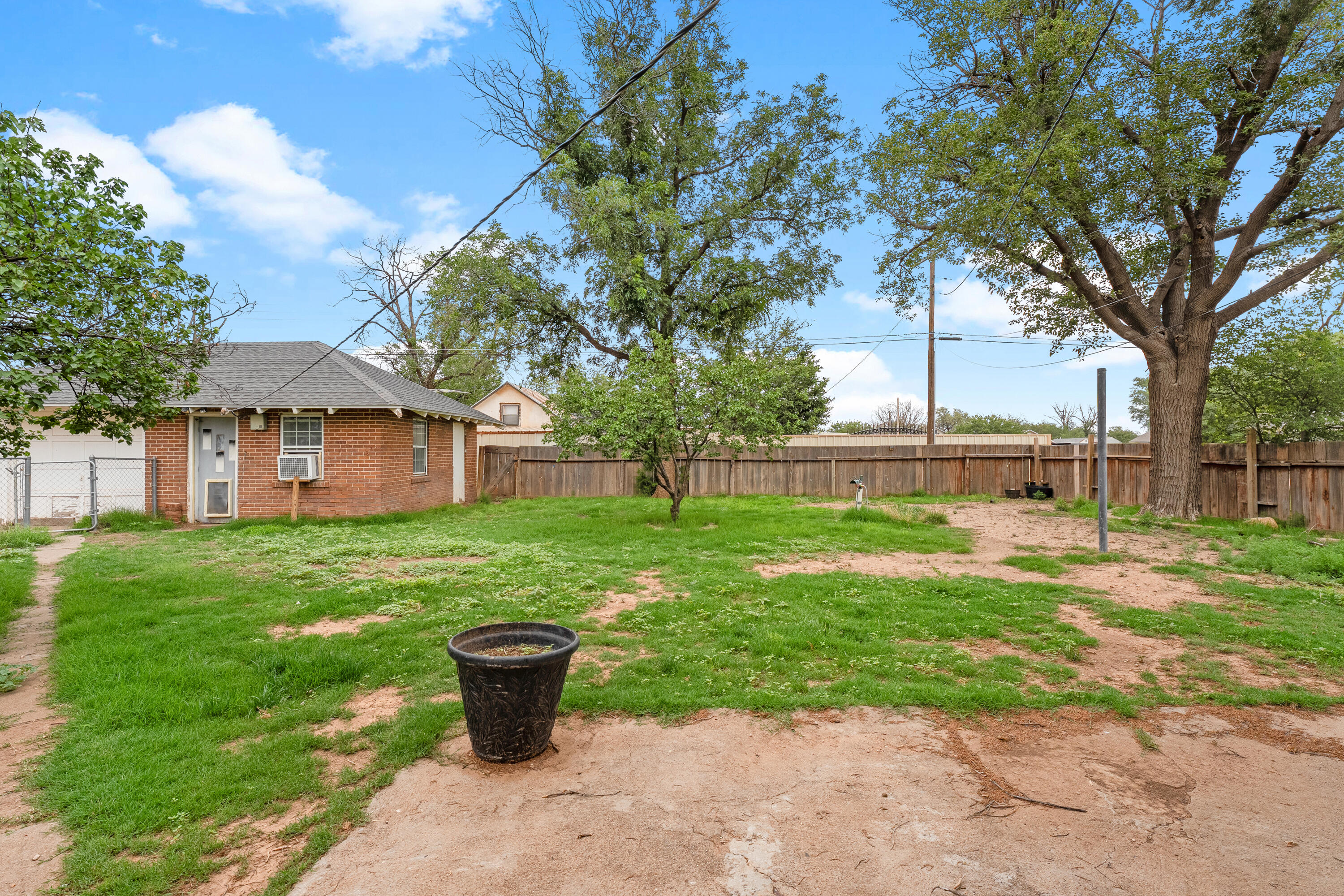 500 West Garza Street Slaton, TX 79364 - Photo 21 of 24 a front view of a house with a yard