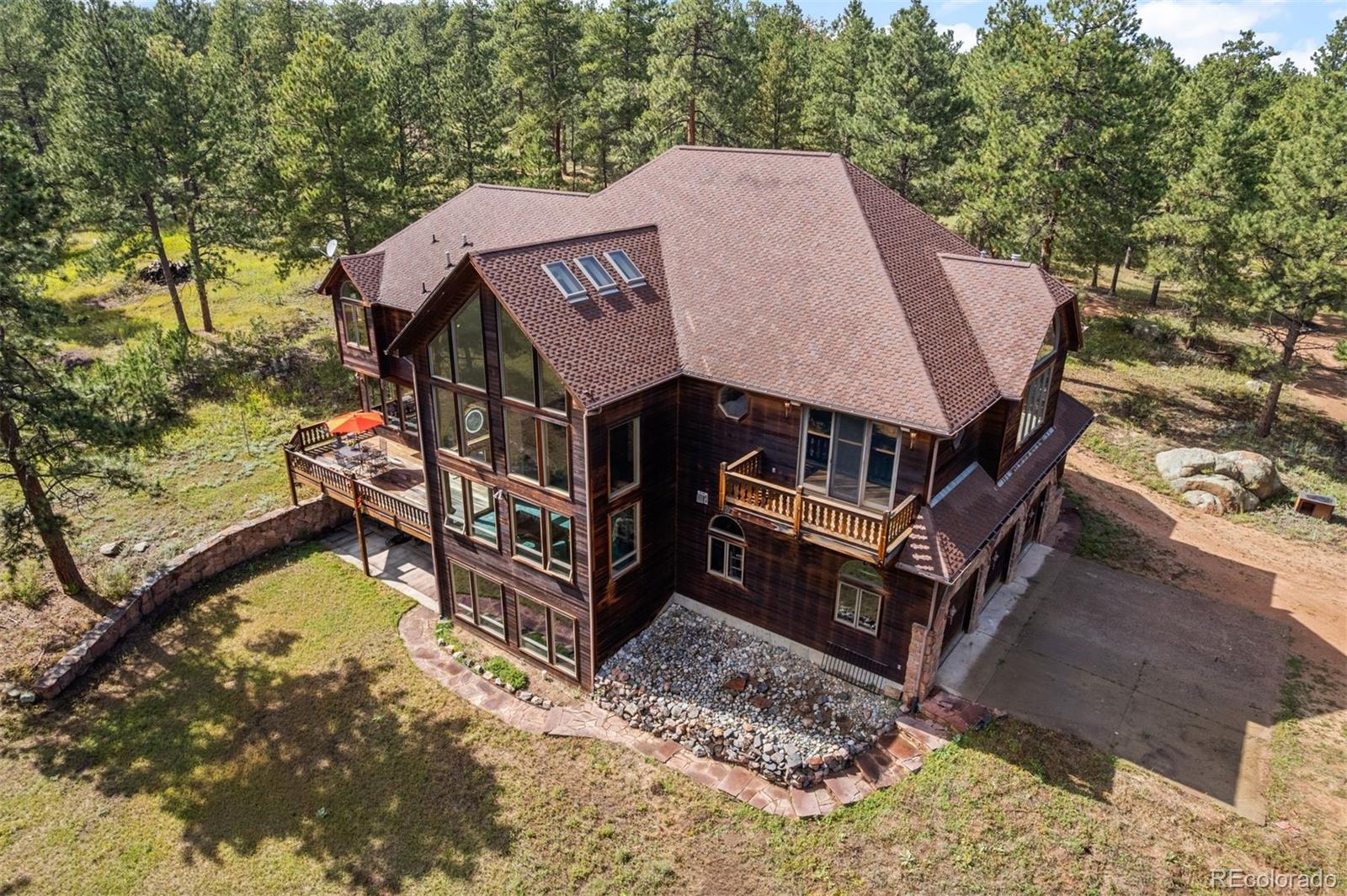 21206 Spring Creek Road Sedalia, CO 80135 - Photo 39 of 50 a aerial view of a house with a yard