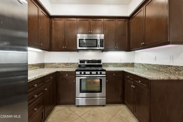 a kitchen with a stove and a sink
