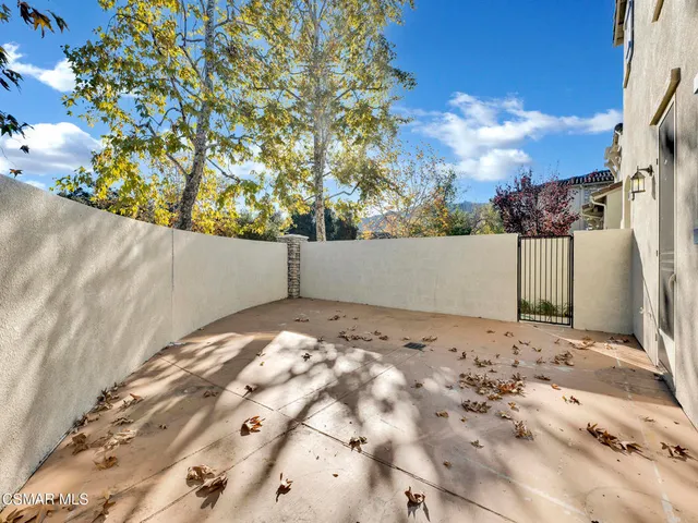 a view of a backyard of the house