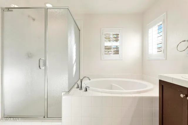 a white bath tub sitting next to a window