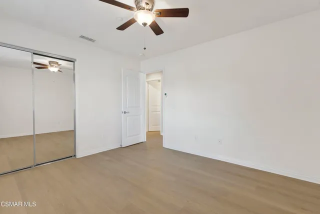 an empty room with fan