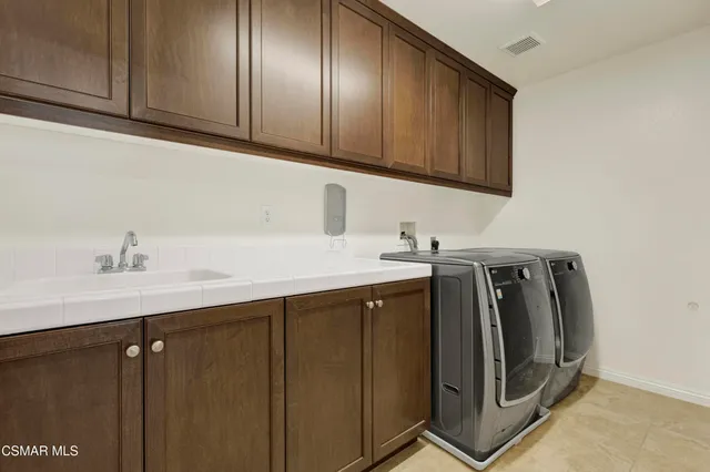 a utility room with cabinets