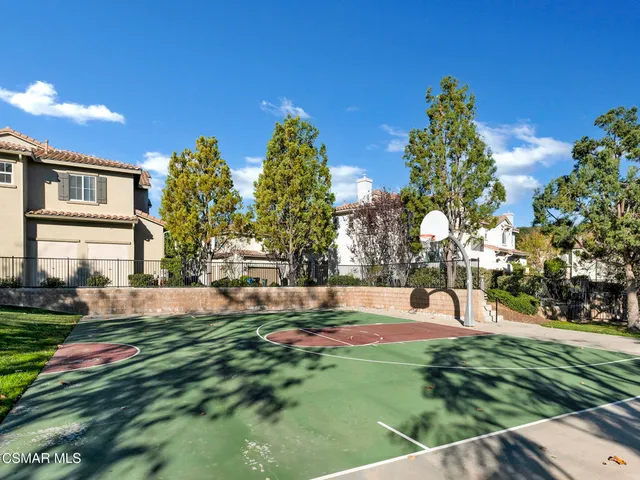 a view of a fountain in front of a house