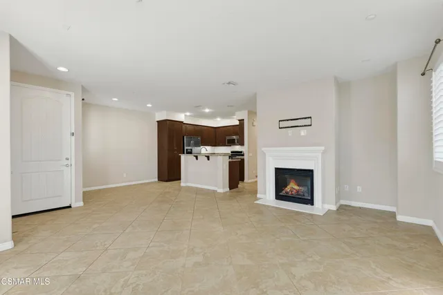 a view of kitchen and a fireplace