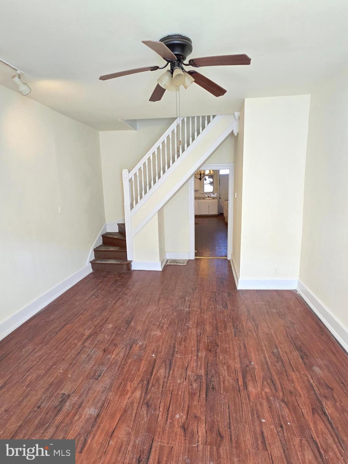 321 South Mount Street Baltimore, MD 21223 - Photo 4 of 20 a view of empty room with wooden floor