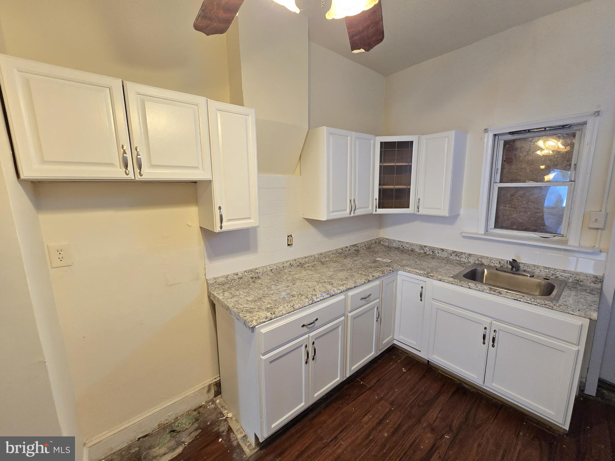 321 South Mount Street Baltimore, MD 21223 - Photo 8 of 20 a view of a sink and mirror