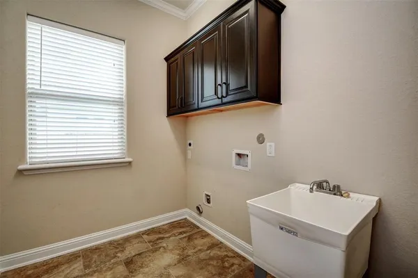 a bathroom with a sink and a window