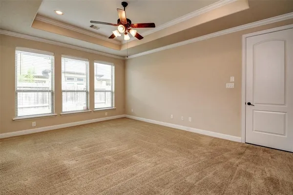 a view of an empty room with a window