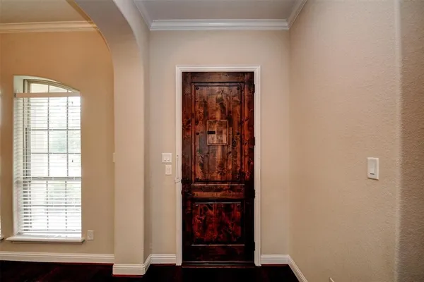 a view of front door with wooden floor