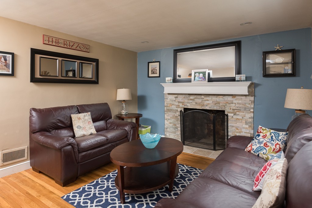 30 Wilder Road Norwell, MA 02061 - Photo 12 of 25 a living room with furniture and a fireplace