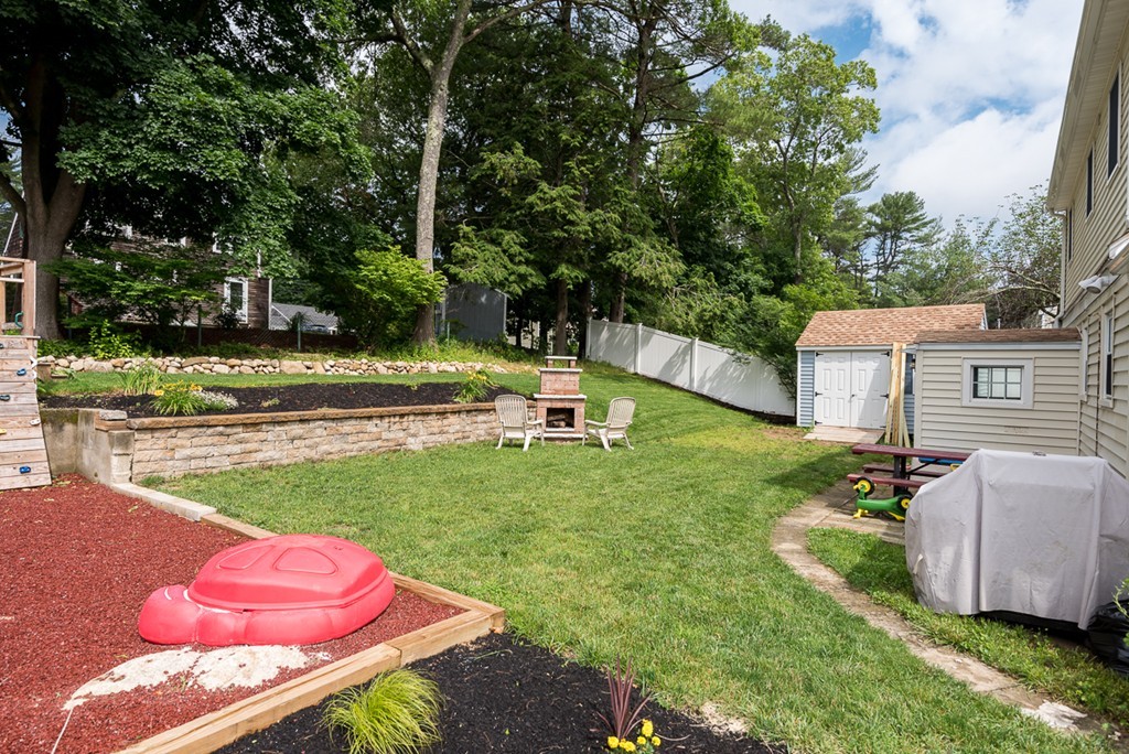 30 Wilder Road Norwell, MA 02061 - Photo 24 of 25 a backyard of a house with table and chairs potted plants and large trees