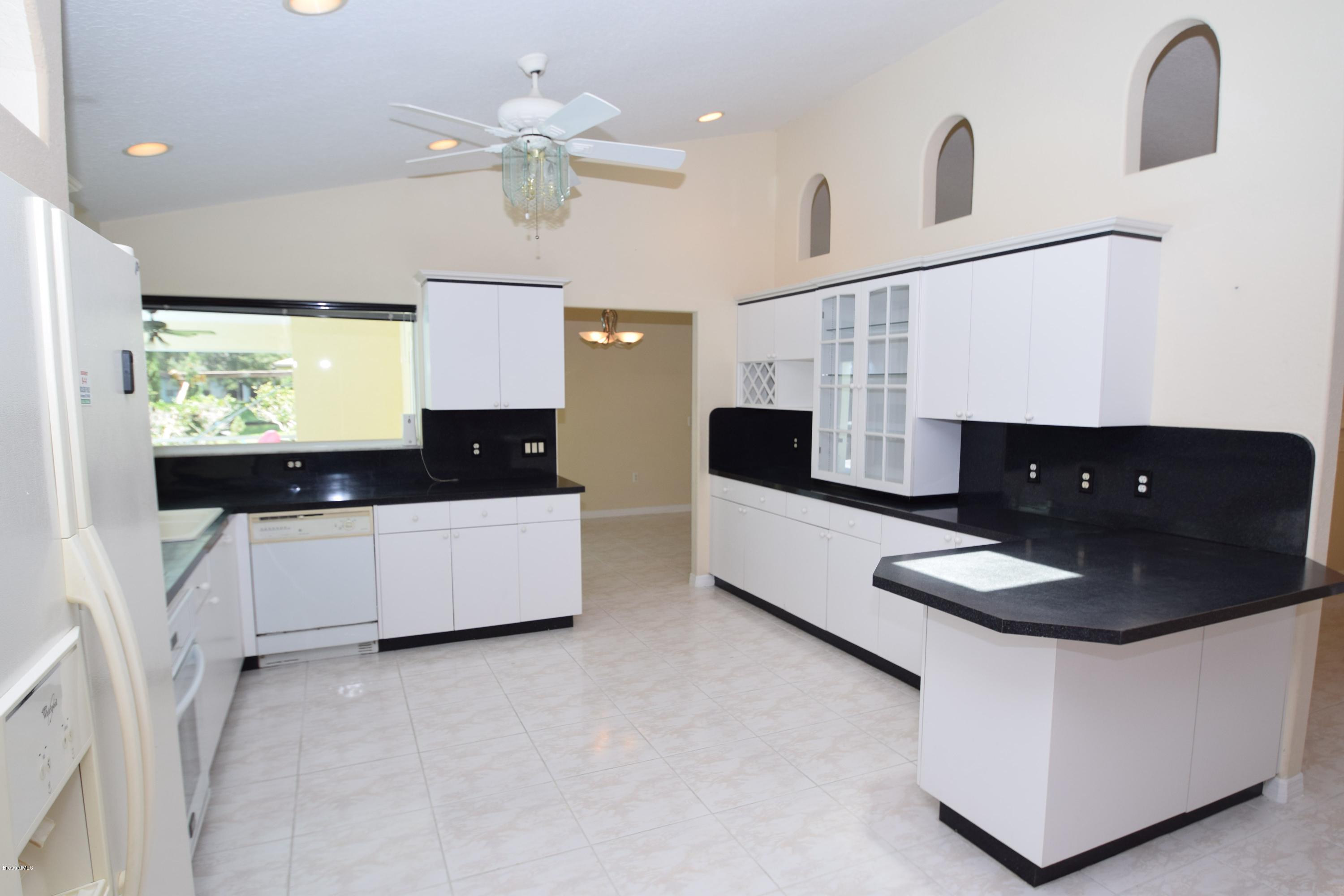 1219 Winding Meadows Road Rockledge, FL 32955 - Photo 12 of 26 PLENTY OF CABINET SPACE FOR STORAGE!