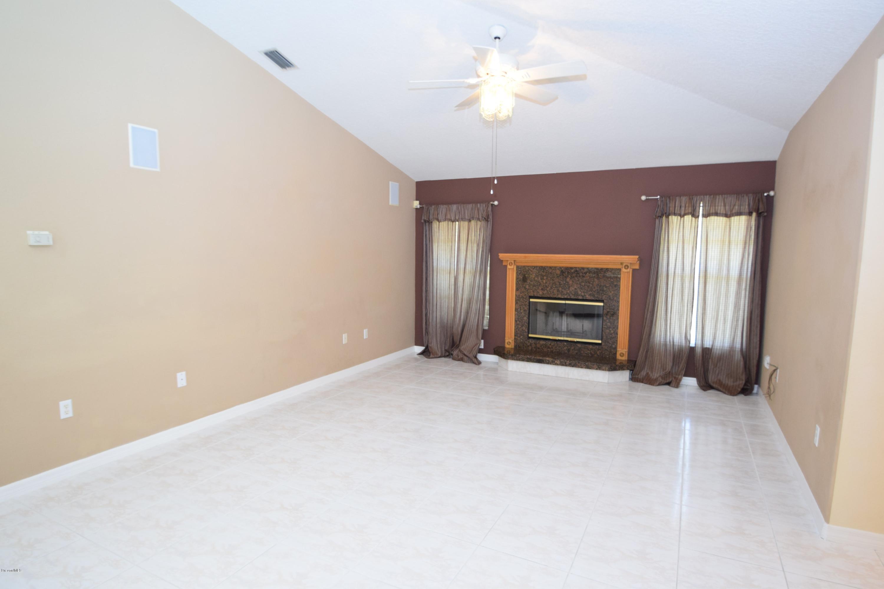 1219 Winding Meadows Road Rockledge, FL 32955 - Photo 13 of 26 WOOD BURNING FIREPLACE!