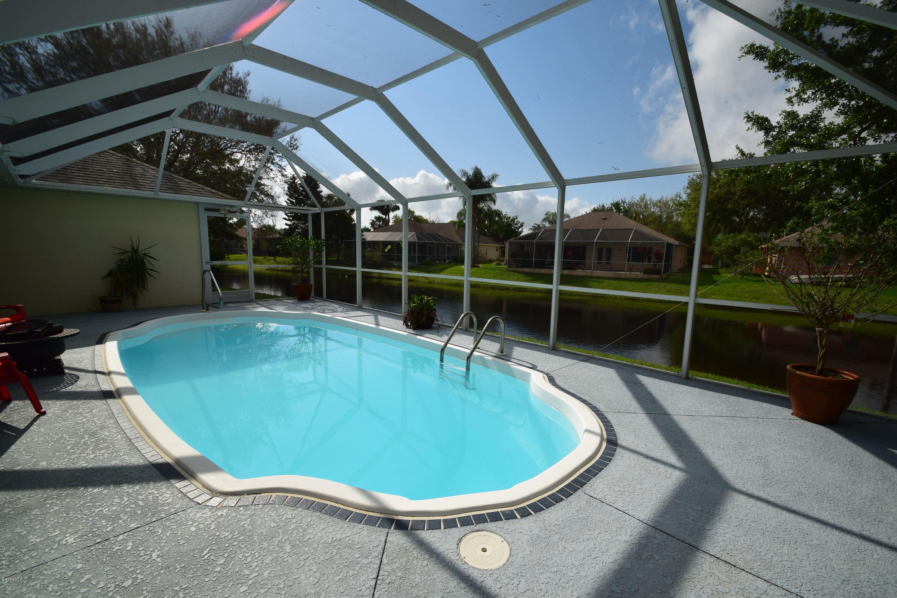 1219 Winding Meadows Road Rockledge, FL 32955 - Photo 21 of 26 GORGEOUS POOL OVERLOOKING LAKE!