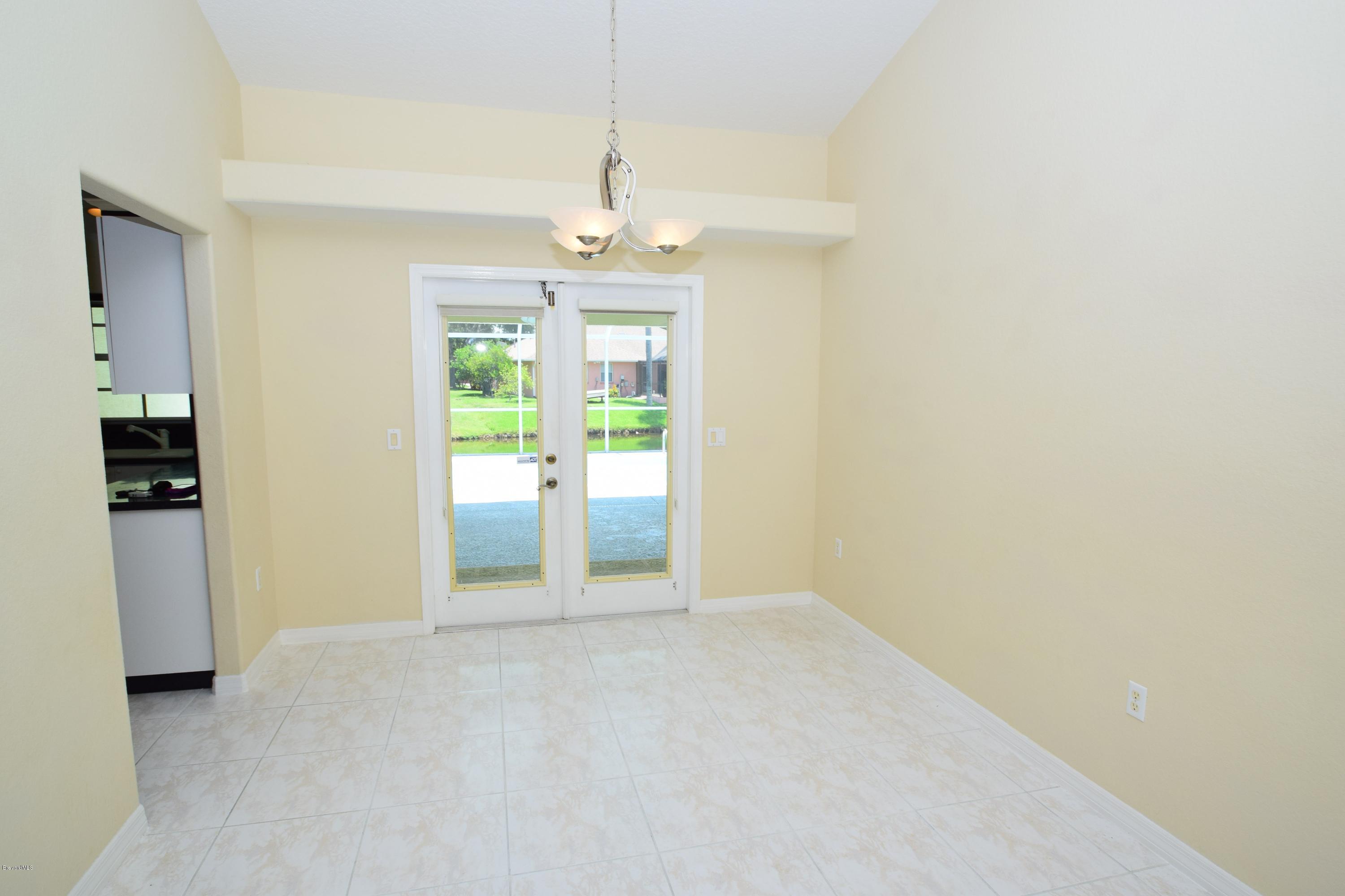 1219 Winding Meadows Road Rockledge, FL 32955 - Photo 6 of 26 DINING AREA OVERLOOKING POOL!