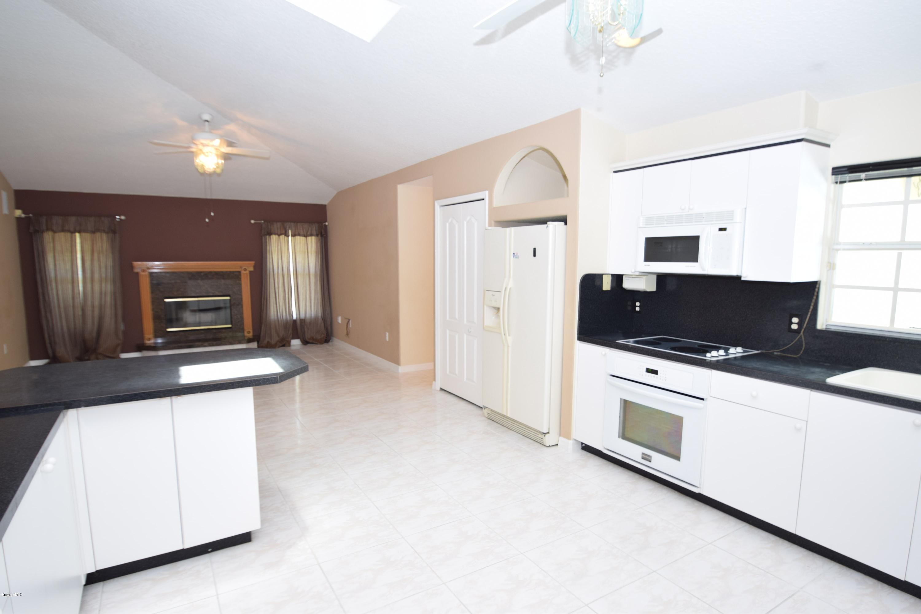 1219 Winding Meadows Road Rockledge, FL 32955 - Photo 10 of 26 PLENTY OF ENTERTAINING SPACE IN KITCHEN!