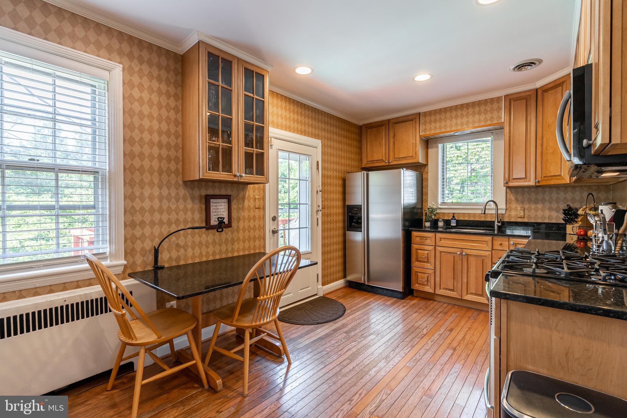 504 Hatherleigh Road Baltimore, MD 21212 - Photo 9 of 42 Kitchen with table space leads to deck