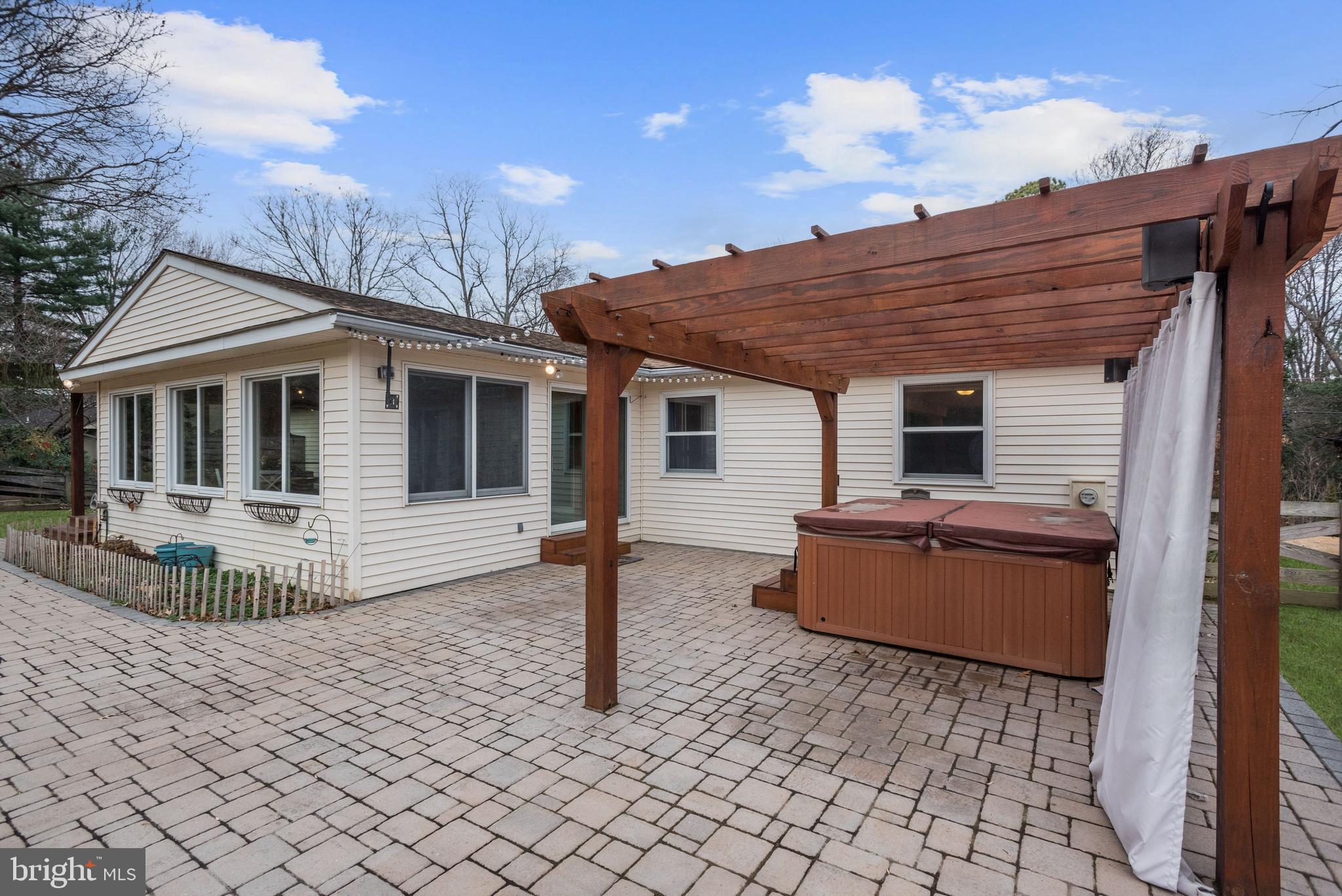 338 Edgewater Road Pasadena, MD 21122 - Photo 33 of 42 Patio with Hot Tub and Pergola