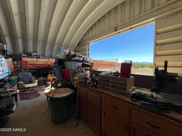 a view of a chairs and table in the balcony