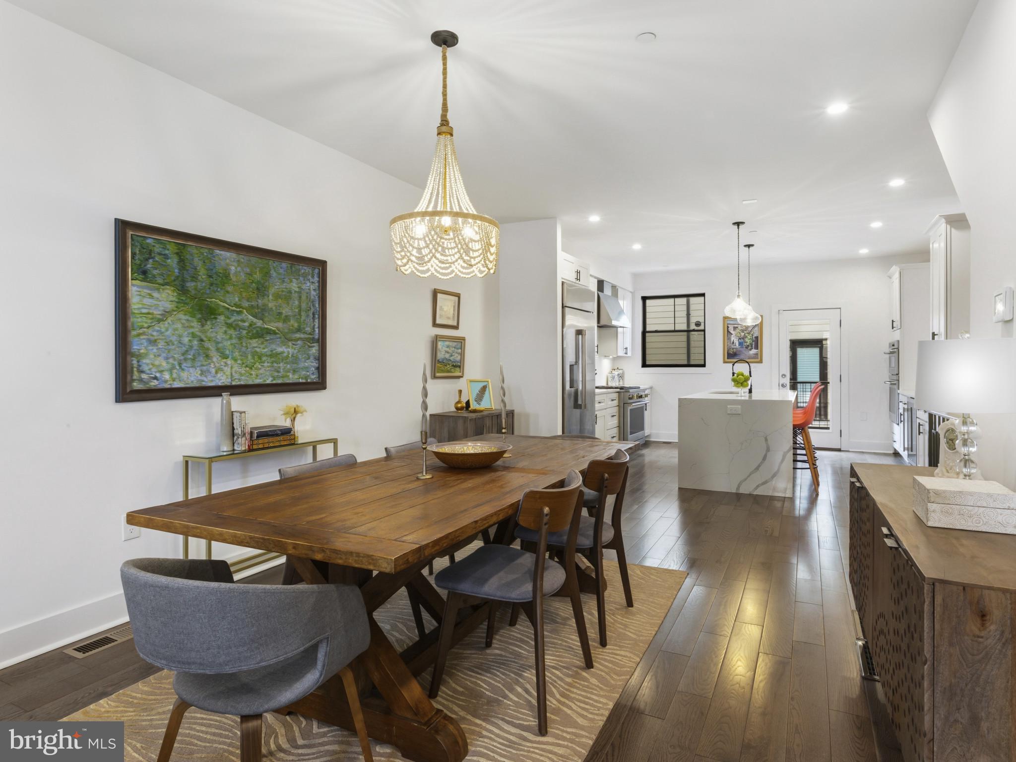 1404 Olive Street Baltimore, MD 21230 - Photo 12 of 38 a view of a dining room with furniture window and wooden floor