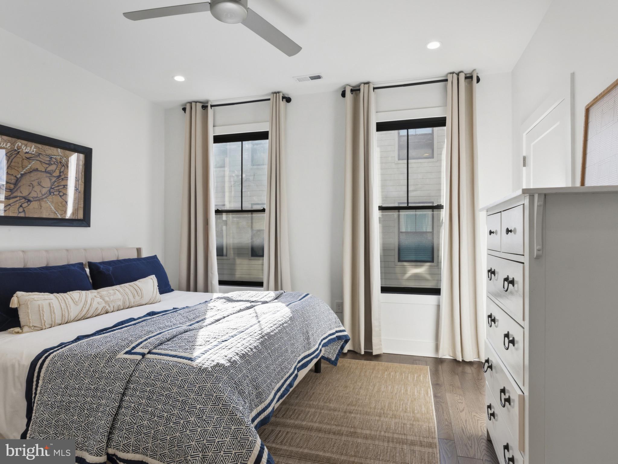 1404 Olive Street Baltimore, MD 21230 - Photo 16 of 38 a bedroom with a bed and a refrigerator