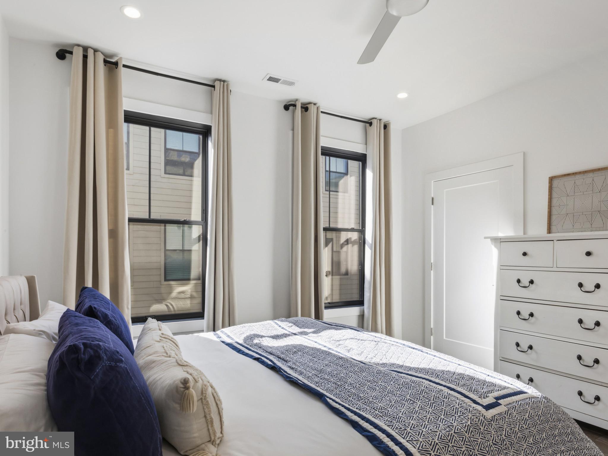 1404 Olive Street Baltimore, MD 21230 - Photo 17 of 38 a bedroom with a bed and a mirror