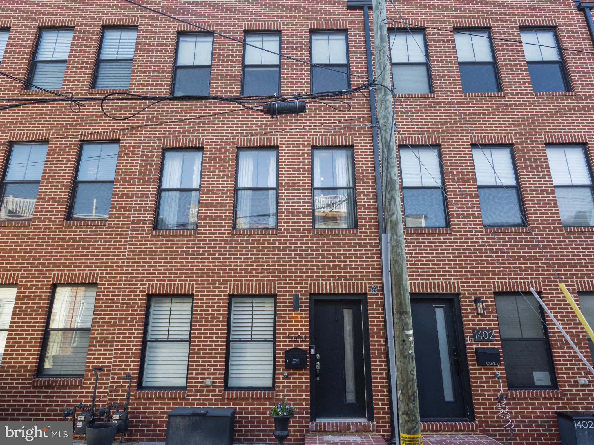 1404 Olive Street Baltimore, MD 21230 - Photo 2 of 38 a front view of a building