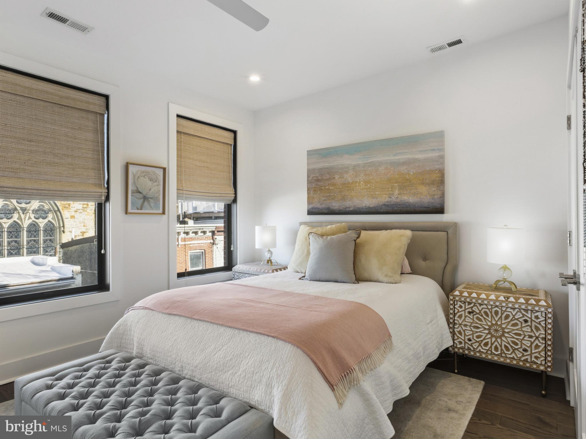 1404 Olive Street Baltimore, MD 21230 - Photo 21 of 38 a bedroom with a bed and wooden floor