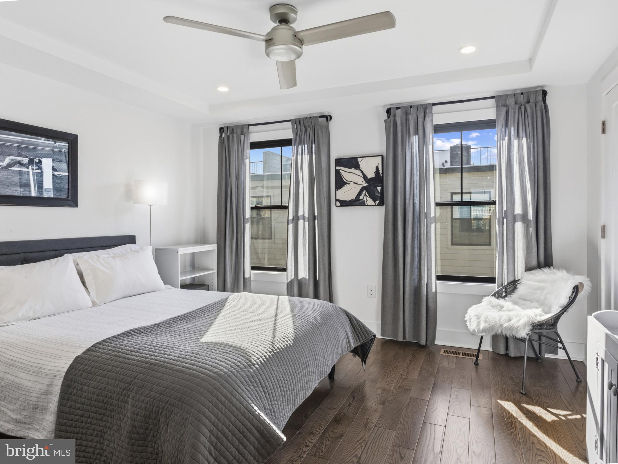 1404 Olive Street Baltimore, MD 21230 - Photo 23 of 38 a bedroom with a bed and a chair