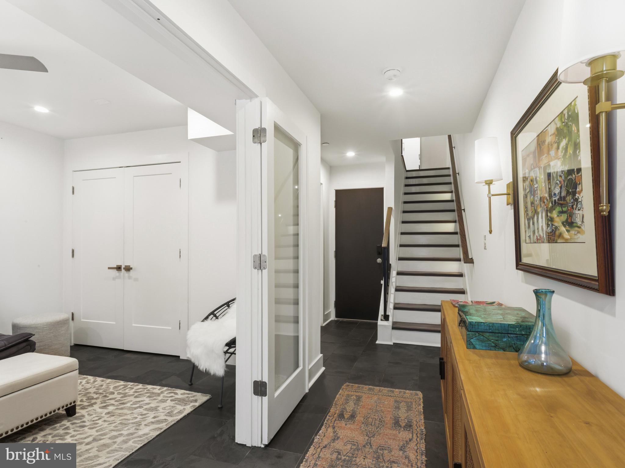 1404 Olive Street Baltimore, MD 21230 - Photo 3 of 38 a bedroom with furniture and wooden floor