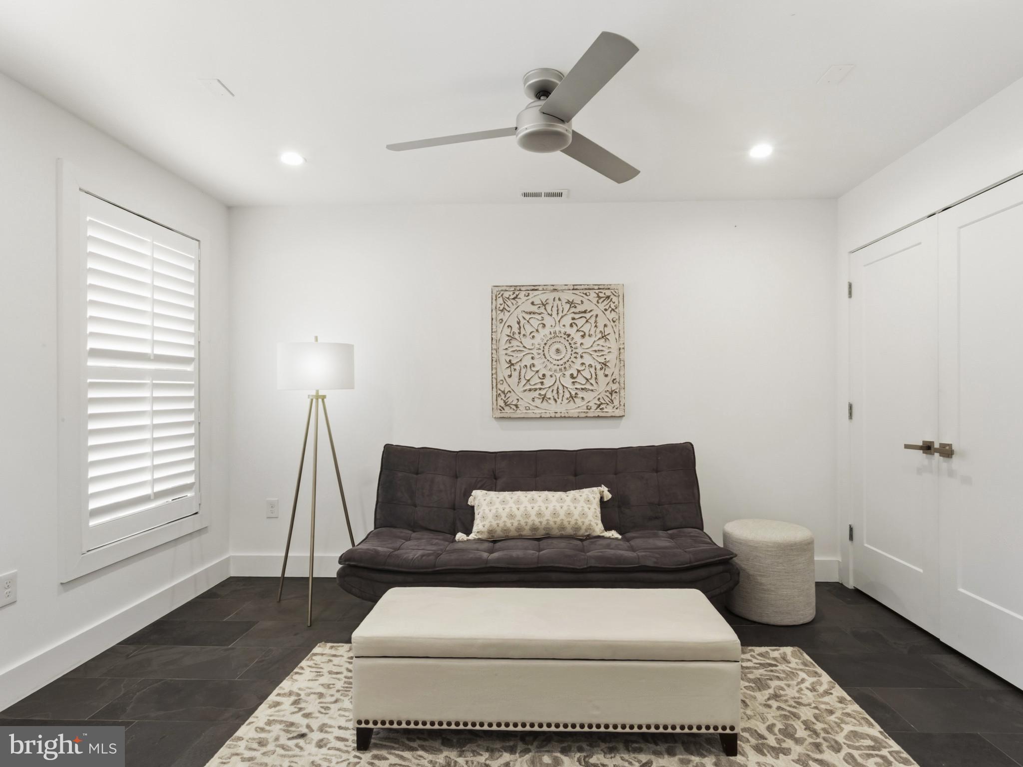 1404 Olive Street Baltimore, MD 21230 - Photo 4 of 38 a white bed sitting in a room next to a window