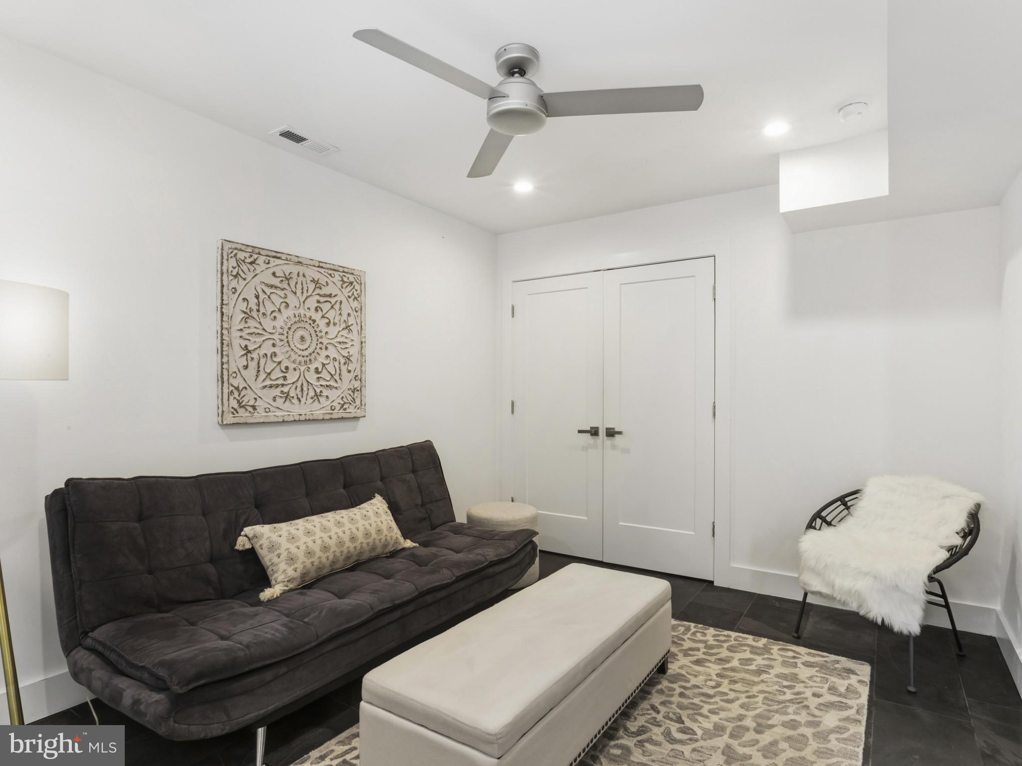 1404 Olive Street Baltimore, MD 21230 - Photo 6 of 38 a living room with a couch and a rug