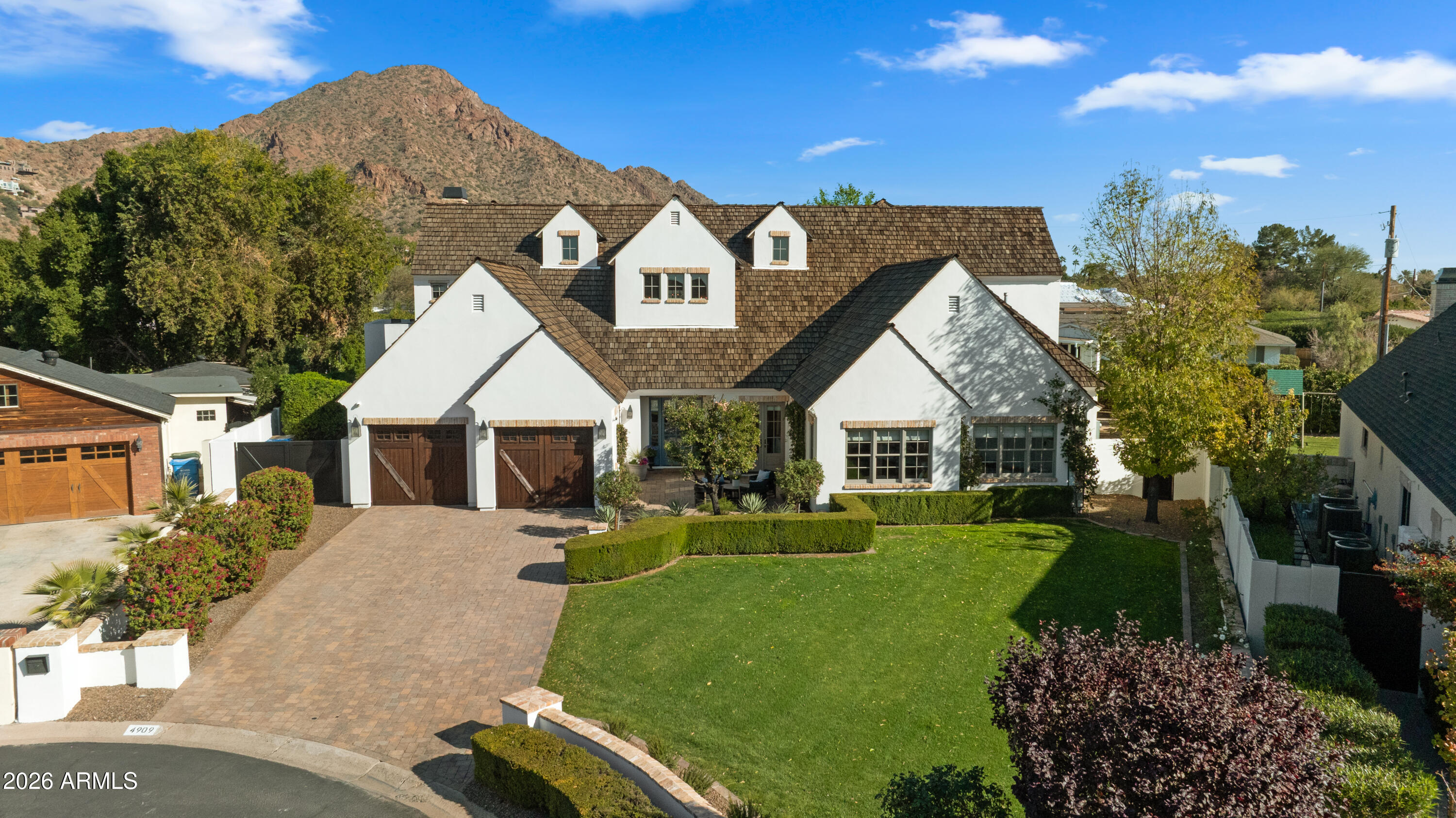 4909 North 45th Place Phoenix, AZ 85018 - Photo 1 of 45 a front view of a house with a yard