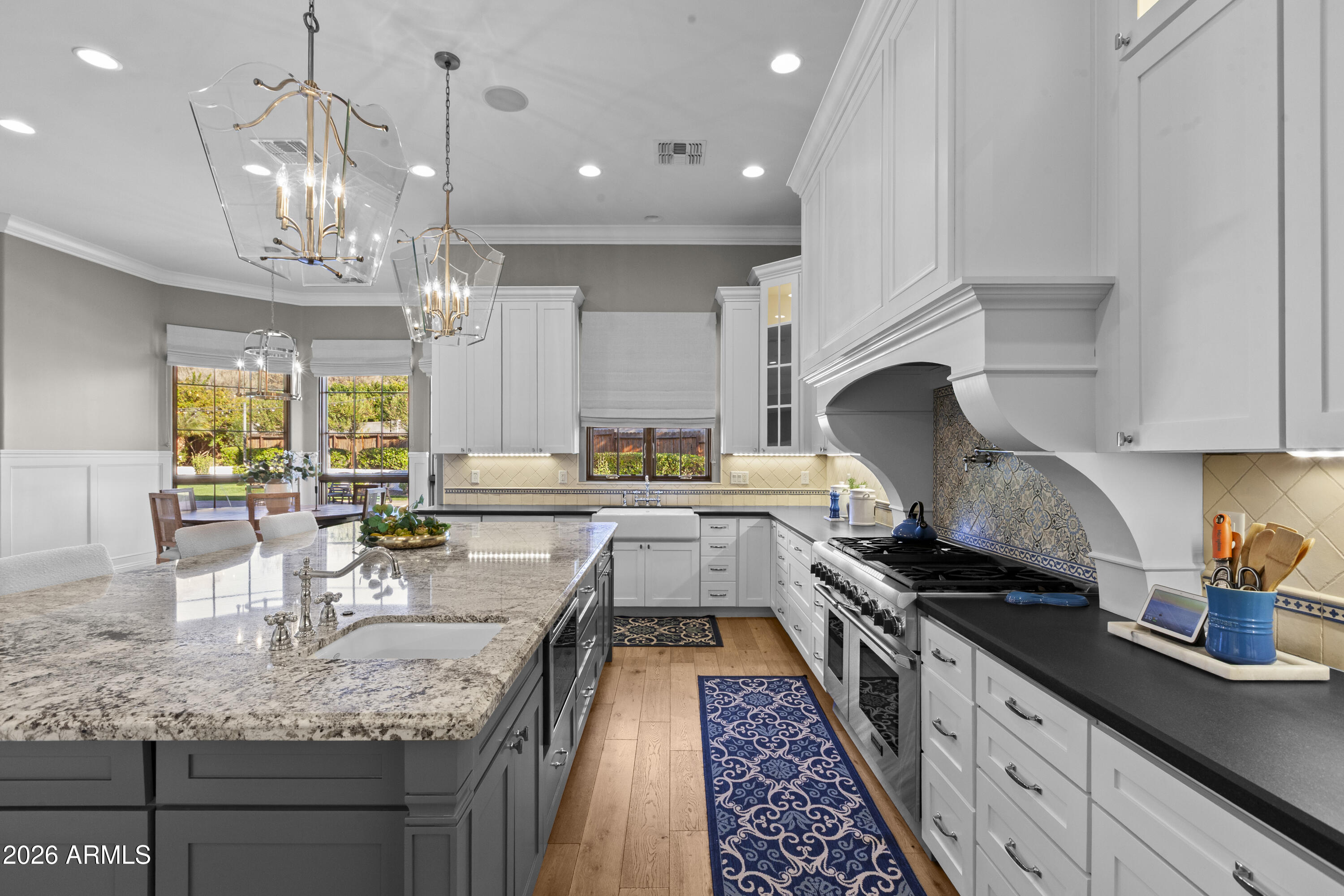 4909 North 45th Place Phoenix, AZ 85018 - Photo 13 of 45 a kitchen with granite countertop lots of counter top space appliances and cabinets